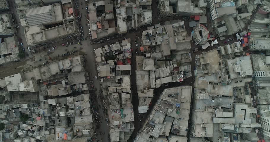 Aerial view of dense urban cityscape with narrow streets and rooftops in Karachi, Sindh, Pakistan.