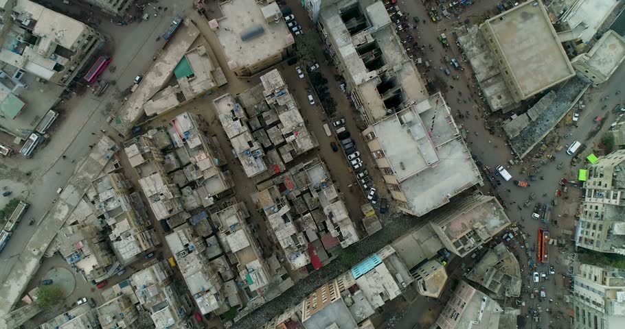 Aerial view of dense urban landscape with crowded streets, residential buildings, and heavy traffic in Karachi, Sindh, Pakistan.