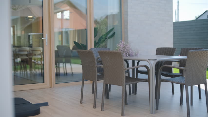 Cozy seating area with wicker furniture on an outdoor terrace