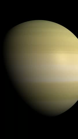 A cinematic view of the planet Saturn rotating slowly in the dark void of outer space.