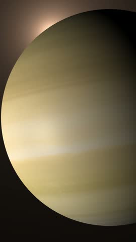 A detailed close up view of the planet Saturn showing atmospheric bands and light reflection.