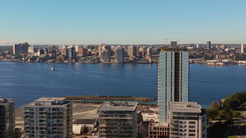 Experience the stunning beauty of Halifax as dawn breaks, with gentle light illuminating the skyline and tranquil waters of the harbor on a peaceful morning in Nova Scotia, Canada.