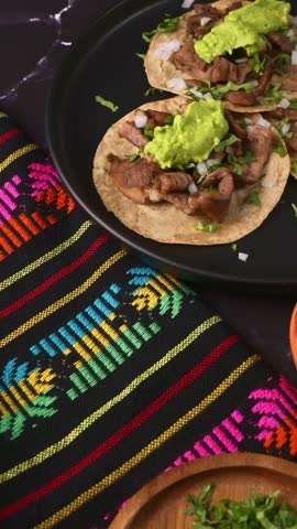 Grilled beef tacos with creamy guacamole and fresh toppings