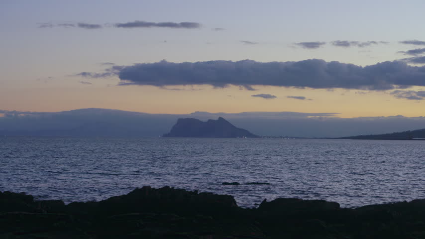 Rock of Gibraltar Silhouette at Dusk over Mediterranean Sea