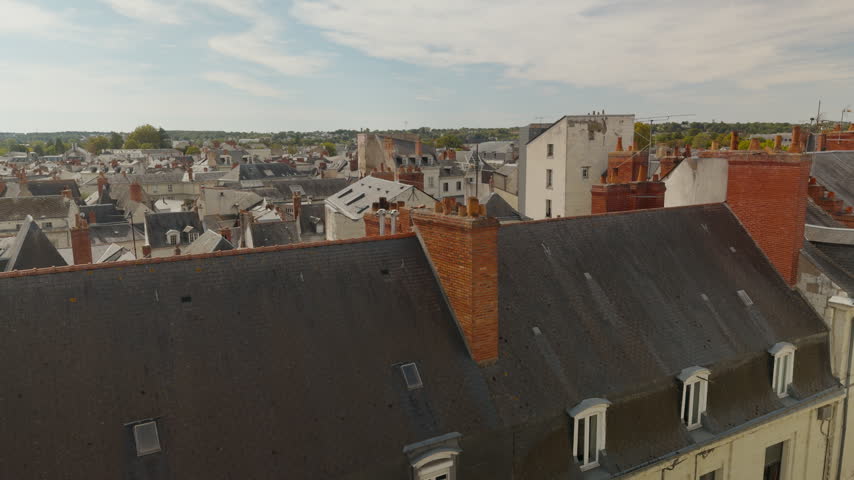 Slow motion view of the historic town center and rooftops of Saumur.