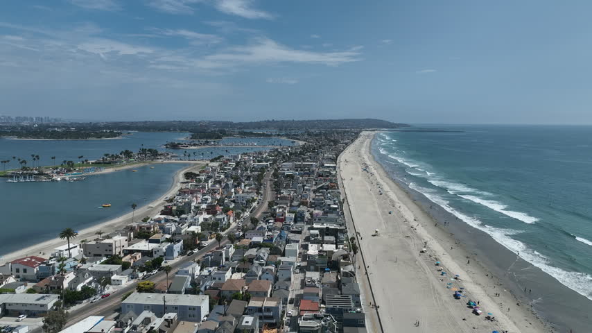 Aerial view of Mission Bay and Beaches in San Diego, California. USA. Community built on a sandbar with villas, sea port and recreational Mission Bay Park. Californian beach-lifestyle.