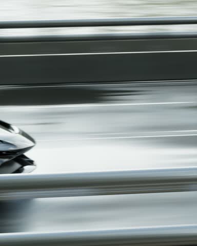 Fast car is speeding down the road