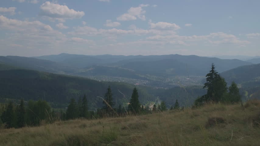 Scenic Mountain Range Landscape with Dirt Road on Ridge
