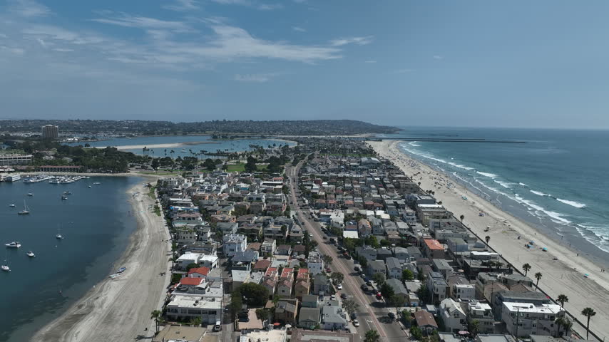 Aerial view of Mission Bay and Beaches in San Diego, California. USA. Community built on a sandbar with villas, sea port and recreational Mission Bay Park. Californian beach-lifestyle.