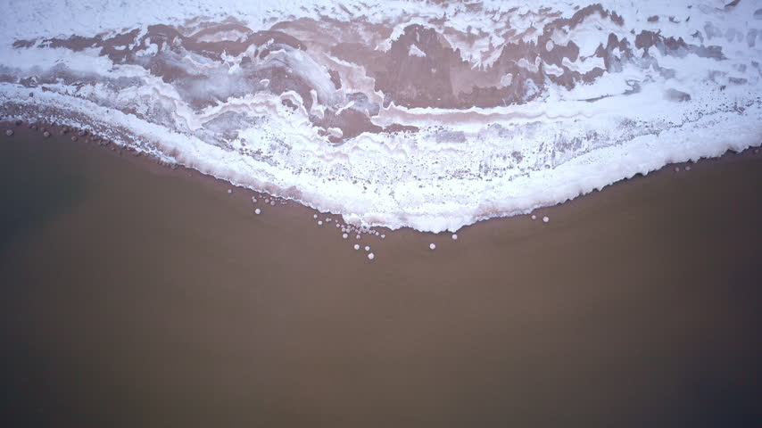 Aerial view of the snow-covered Lake Superior coast in Northern Michigan