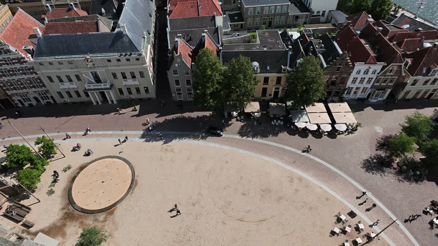 Overhead view of paved town square near Lebuinuskerk with visitors