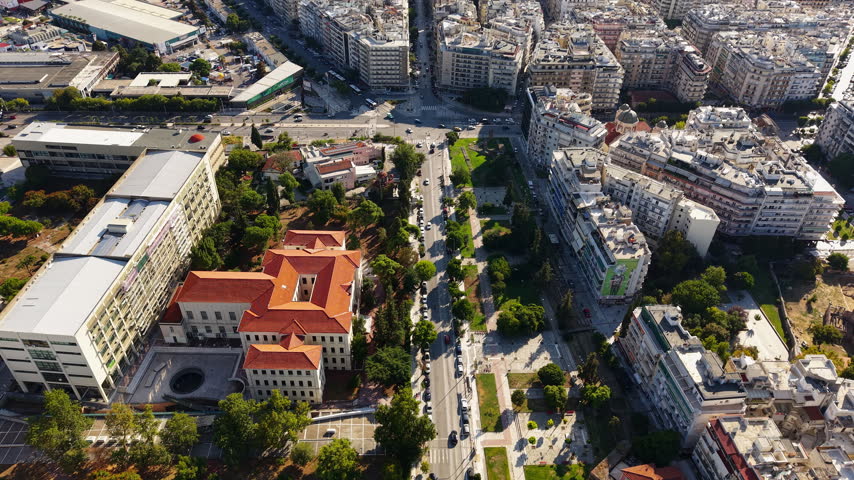 Drone View of Thessaloniki, Greece, City Center Buildings, Streets and Cargo Ships in Aegean Sea