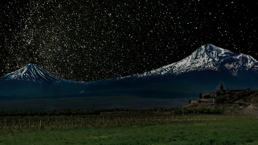 Milky Way Galaxy stretching across the night sky above the majestic snow-capped Mount Ararat and a historic monastery. Khor Virap monastery. Starry night sky