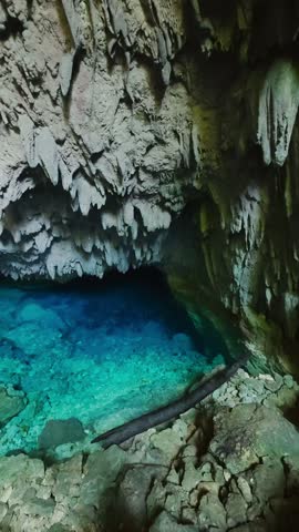 Natural underground pool with blue water in a cave Ba