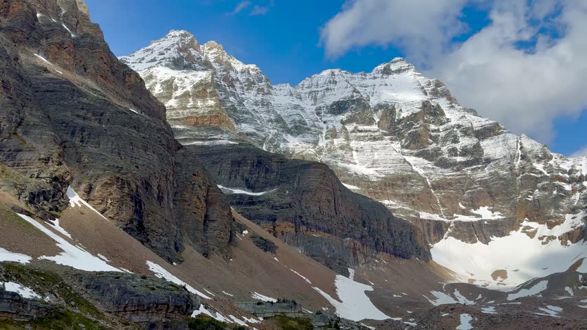 turquoise Alpine Lake Oesa Surrounded by Dramatic Snow-Capped Rocky Mountains in Canadian Rockies