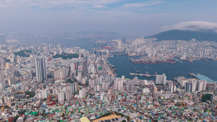 Aerial view approaching the Busan harbor and city center, summer day in Korea