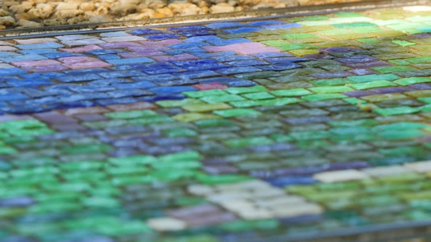 Blue and green mosaic tiled ground