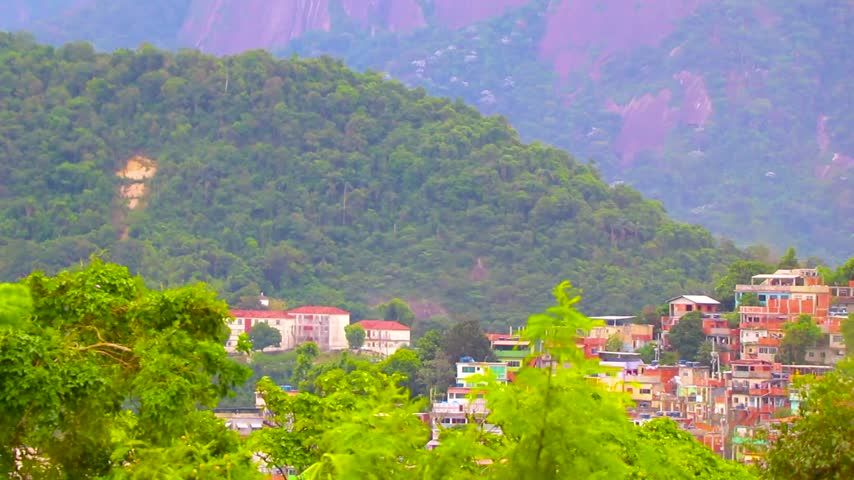 Iconic Christ the Redeemer monument rising above Rio de Janeiro on Corcovado Mountain, presenting a recognizable Brazilian travel landmark and sweeping cityscape in Rio de Janeiro State of Rio de Janeiro Brazil.