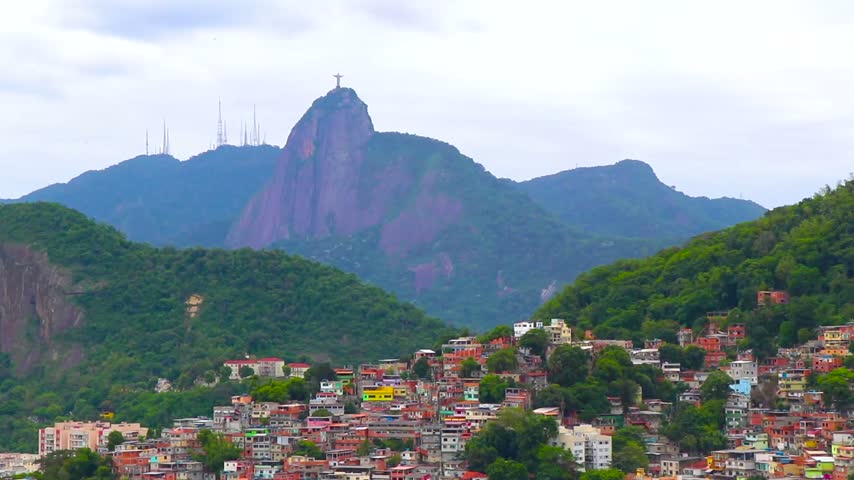Iconic Christ the Redeemer monument rising above Rio de Janeiro on Corcovado Mountain, presenting a recognizable Brazilian travel landmark and sweeping cityscape in Rio de Janeiro State of Rio de Janeiro Brazil.