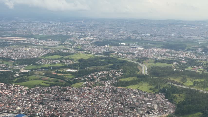 Aerial view of Rio De Janeiro landscape in Brazil with urban and green areas visible