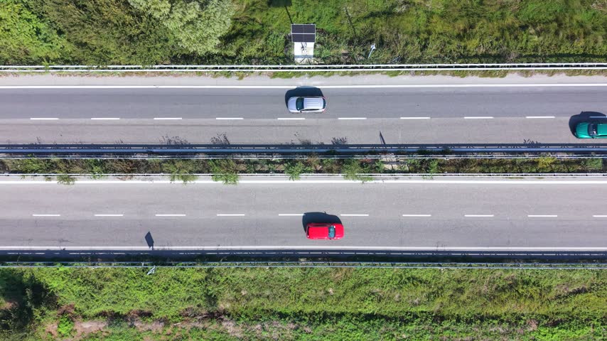 Provincial Road with Moving Traffic Viewed from Above in Northern Italy