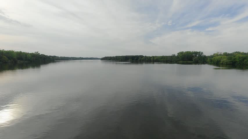 The Mississippi River Near Coon Rapids Dam, Viewed From The Rush Creek Regional Trail Amid Wooded Riverfront Scenery In Minnesota. POV Shot