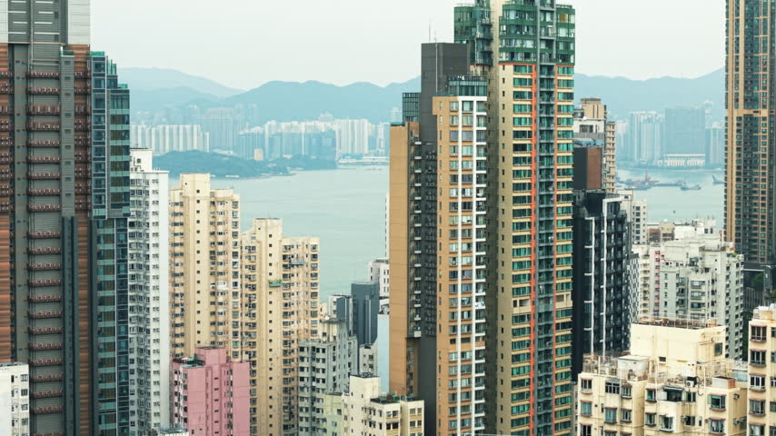 Dense high-rise residential buildings in Hong Kong by the harbor