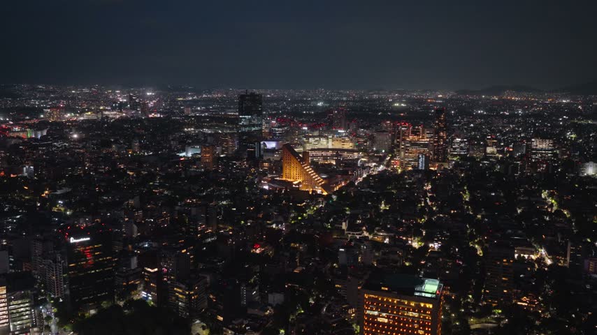 Aerial view of Polanco district illuminated at night with skyscrapers and urban lights in Mexico City, Mexico.