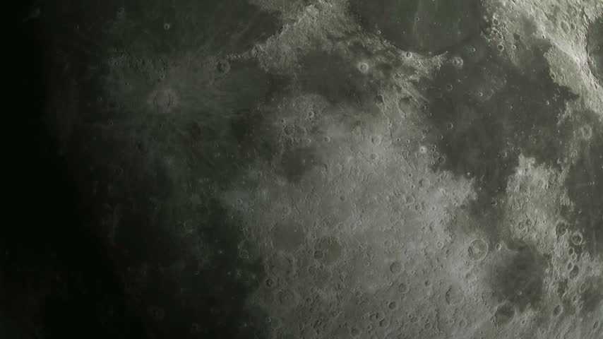 A high resolution close up of the moon surface showing detailed craters and lunar landscape.