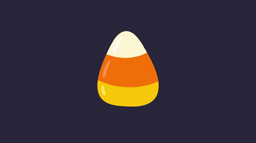 Classic candy corn isolated on a dark background, a vibrant symbol of autumn and Halloween treats.