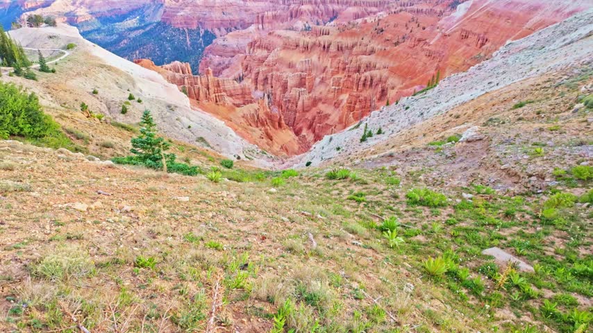 Golden sunrise light glows over the amphitheater formations at Spectra Point along the Ramparts Overlook Trail in Cedar Breaks National Monument