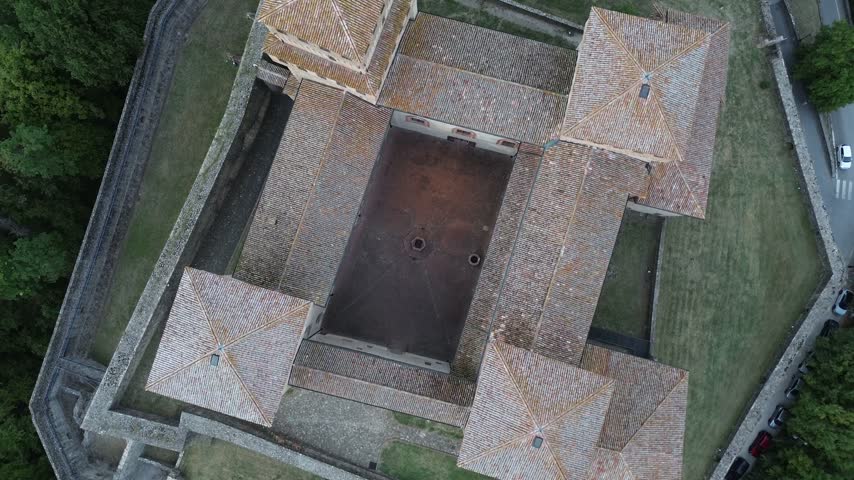 Torrechiara Castle aerial view of 15th century Italian fortress at sunset epic monument to power and eternal love story cinematic camera movement Parma region