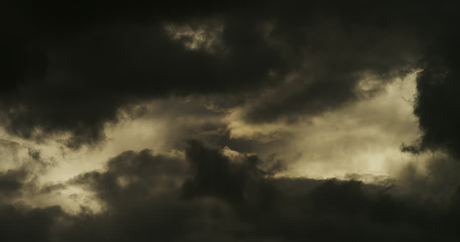 Cloudscape featuring a dramatic, turbulent sky filled with heavy, layered cloud formations.