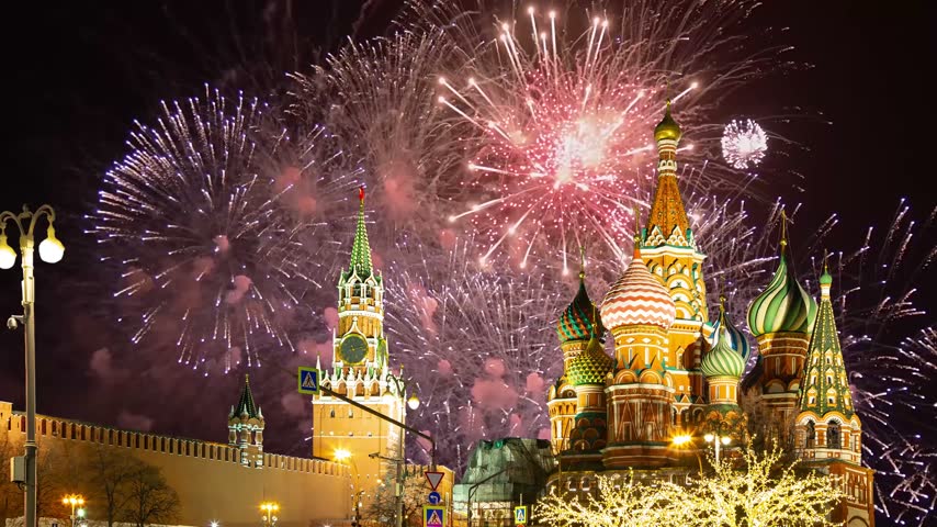 Temple of Basil the Blessed and fireworks in honor of Victory Day celebration (WWII), Red Square, Moscow, Russia. Time lapse, with zoom