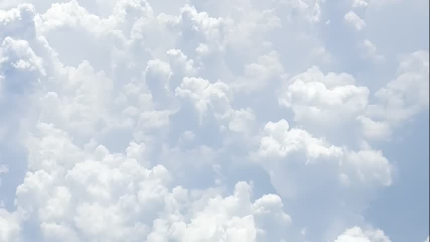 Passing through the clouds in an airplane. View from the window.