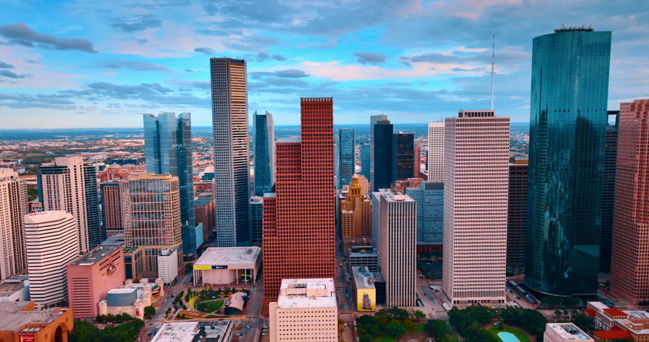 Diverse high-rise architecture in the modern downtown skyline. Skyscrapers of Houston, Texas, USA against cloudy sky.