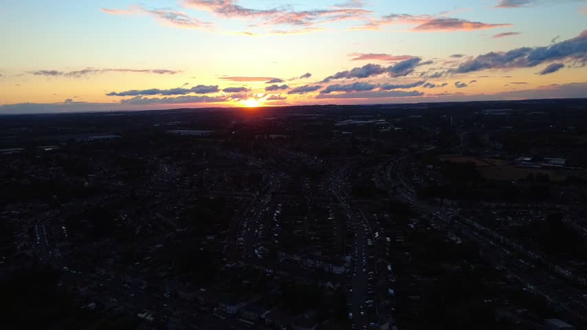 Drone footage at sunset showing fields, roads and open green spaces around Ansty Road in Coventry. The warm evening illumination creates a natural and atmospheric landscape scene.