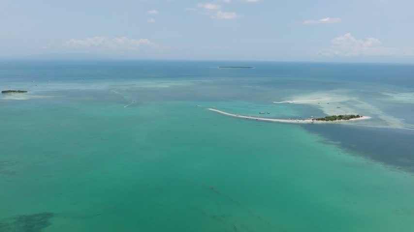 An aerial view of the sandbar and turquoise waters surrounding Virgin Island, Panglao, Philippines