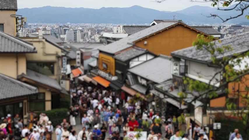 Panoramic view of Kyoto city with Kyoto Tower, traditional rooftops and mountains from Kiyomizu-dera Temple, Higashiyama Ward, Kyoto, Kansai, Honshu Island, Japan