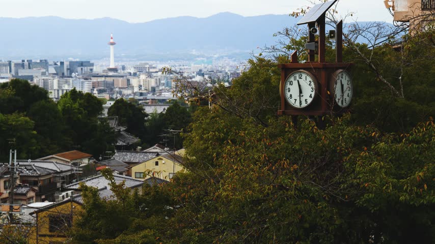 Panoramic view of Kyoto city with Kyoto Tower, traditional rooftops and mountains from Kiyomizu-dera Temple, Higashiyama Ward, Kyoto, Kansai, Honshu Island, Japan