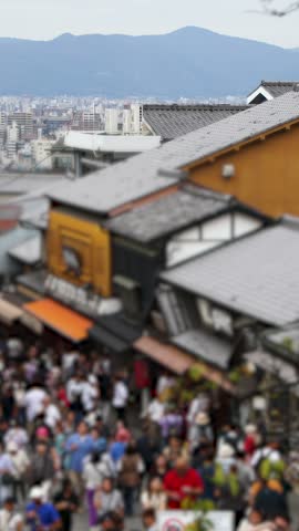 Panoramic view of Kyoto city with Kyoto Tower, traditional rooftops and mountains from Kiyomizu-dera Temple, Higashiyama Ward, Kyoto, Kansai, Honshu Island, Japan