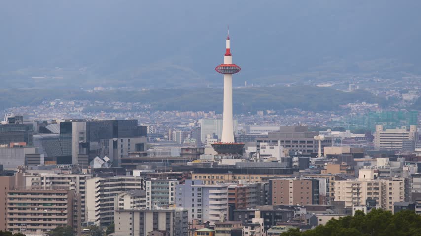 Panoramic view of Kyoto city with Kyoto Tower, traditional rooftops and mountains from Kiyomizu-dera Temple, Higashiyama Ward, Kyoto, Kansai, Honshu Island, Japan