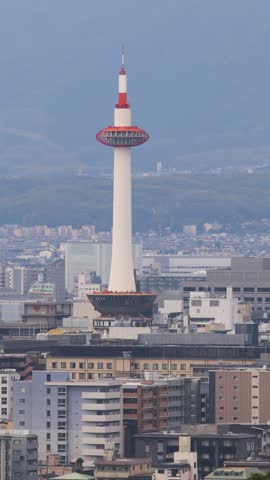 Panoramic view of Kyoto city with Kyoto Tower, traditional rooftops and mountains from Kiyomizu-dera Temple, Higashiyama Ward, Kyoto, Kansai, Honshu Island, Japan