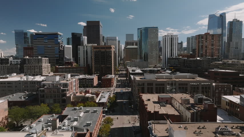 Aerial view of skyscrapers and streets in downtown Denver. Shot on a sunny day in Colorado.