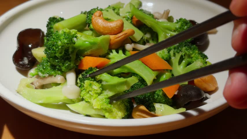 Chopsticks Lifting Broccoli Vegetable Qingdao Chinese Seasonal Greens