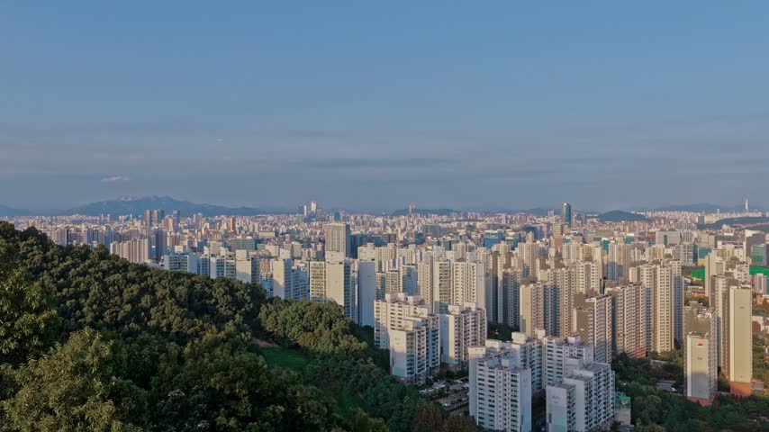 Seoul Metropolitan Area Cityscape With Apartment Buildings And Wooded Hill
