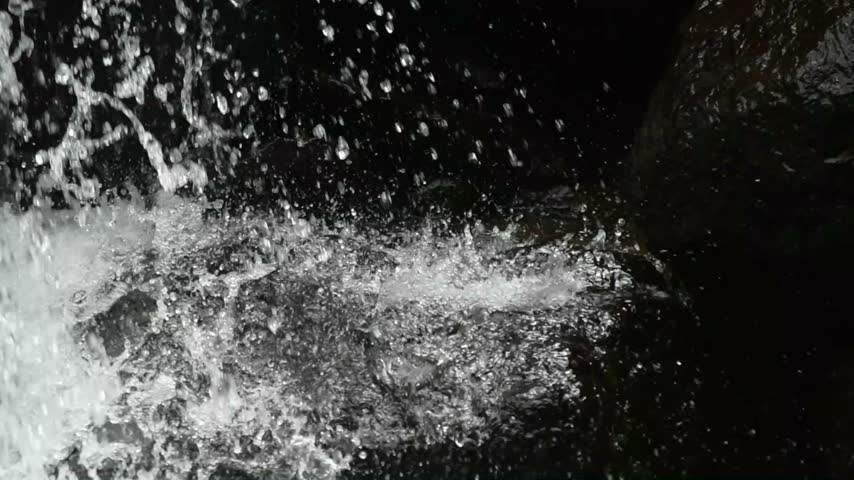 Beautiful Waterfall Cascading Over Natural Rocky Cliff