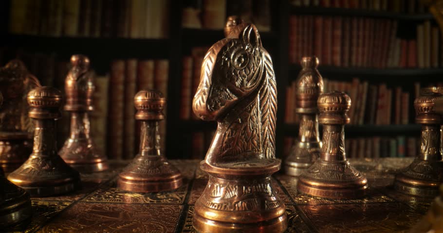 Camera Moves Between Antique Chess Pieces in a Vintage Library.