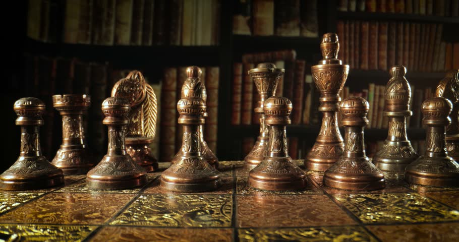 Camera Moves Between Antique Chess Pieces in a Vintage Library.