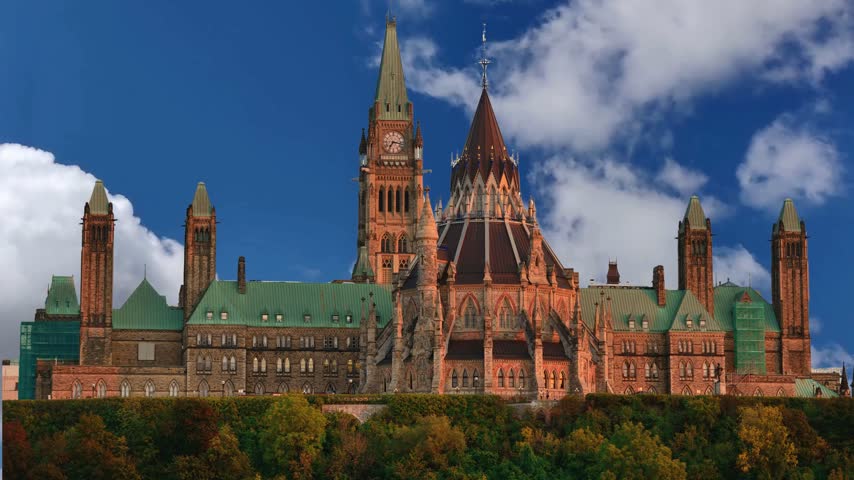 Canadian Parliament in Ottawa in a sunny day, CanadaSlow zoom in on the Canadian Parliament buildings in Ottawa, OntarioAutumn panorama of Parliament Hill and Ottawa River with Canada iconic government buildings with Peace Tower in Canada